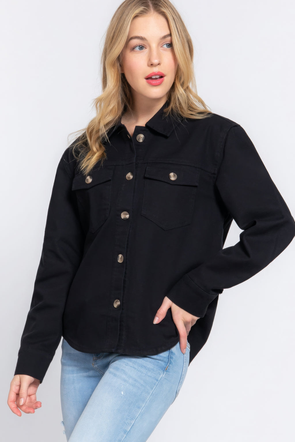 Black cotton denim shacket close-up: button placket, collar, and chest pockets