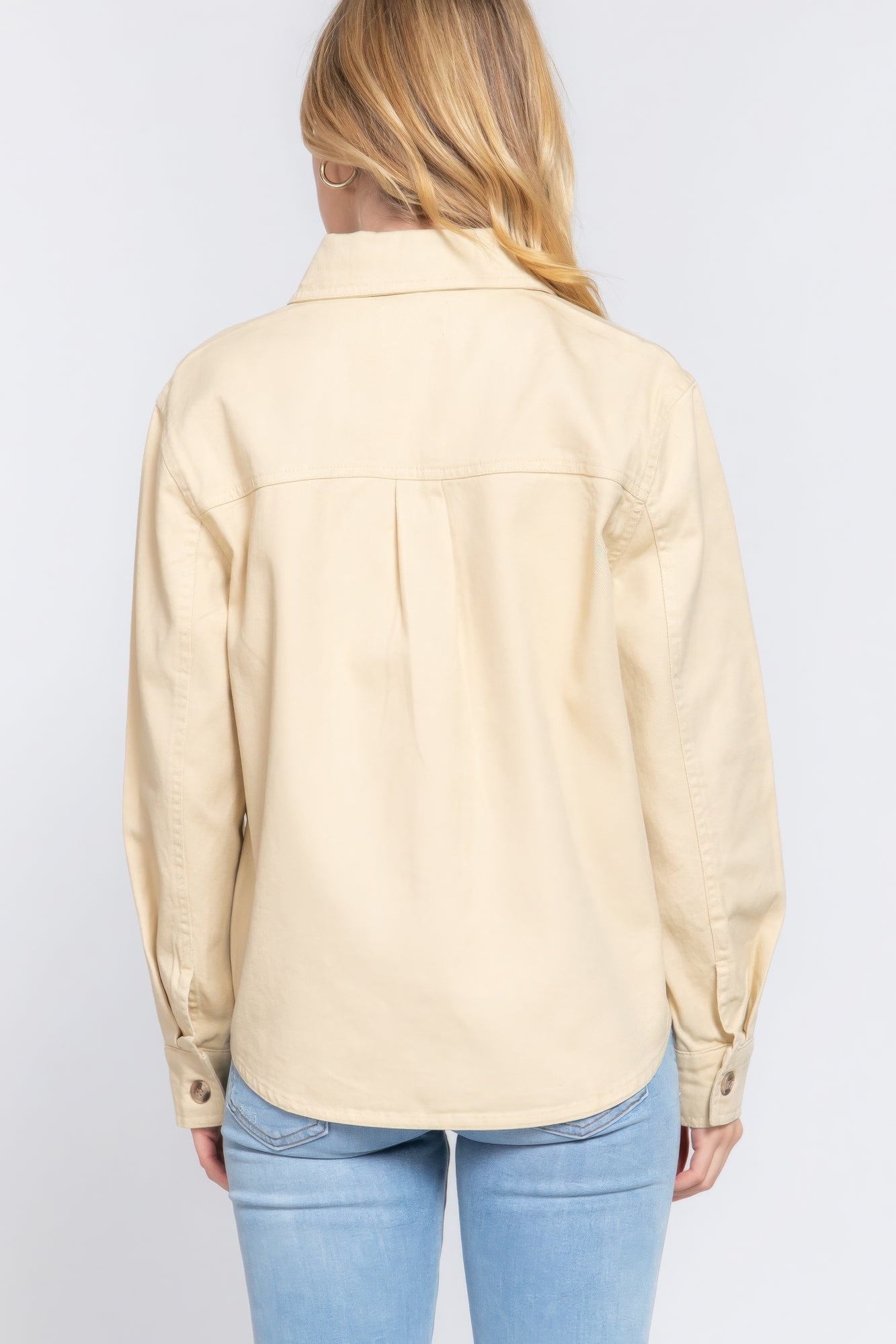 Taupe cotton denim shacket back view with buttoned placket, yoke seams, long sleeves