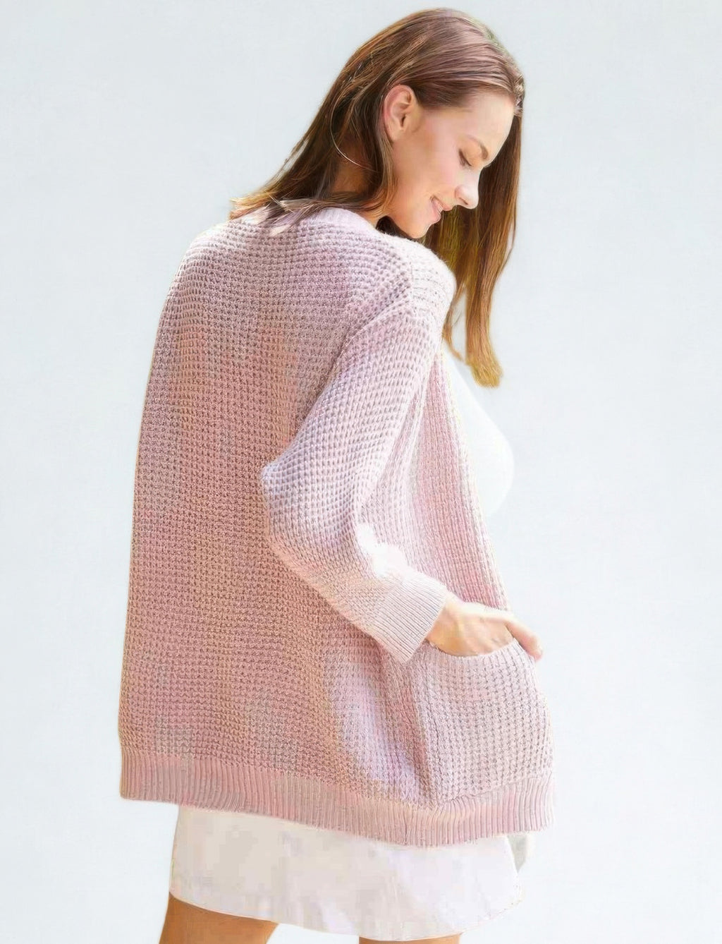 Back view of mauve knit cardigan with ribbed hem and long sleeves