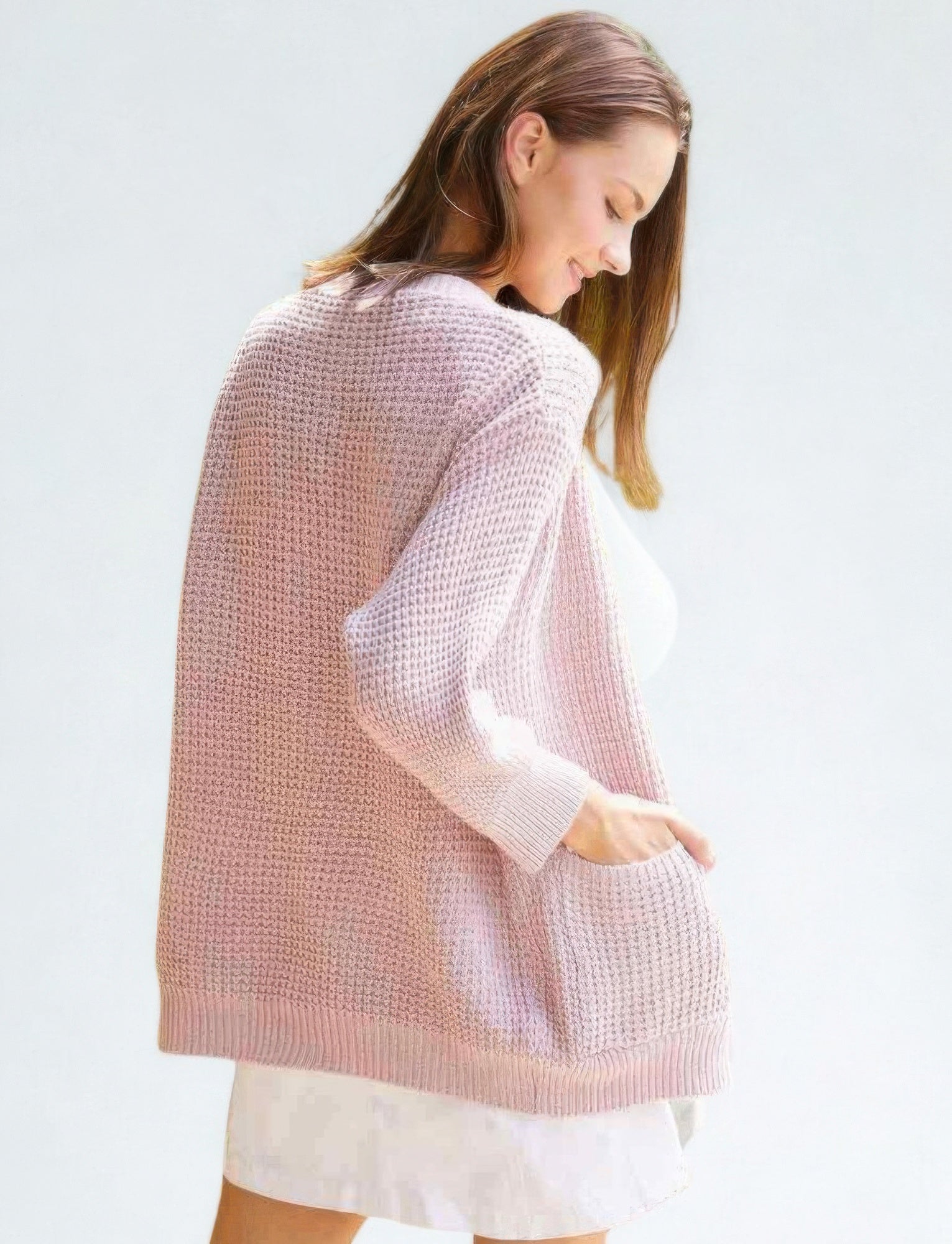 Back view of mauve knit cardigan with ribbed hem and long sleeves