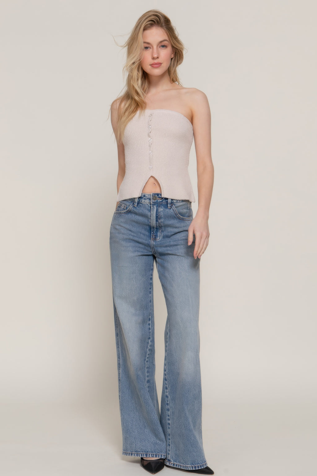 Light taupe bandeau sweater with vertical buttons and cutout opening at waist