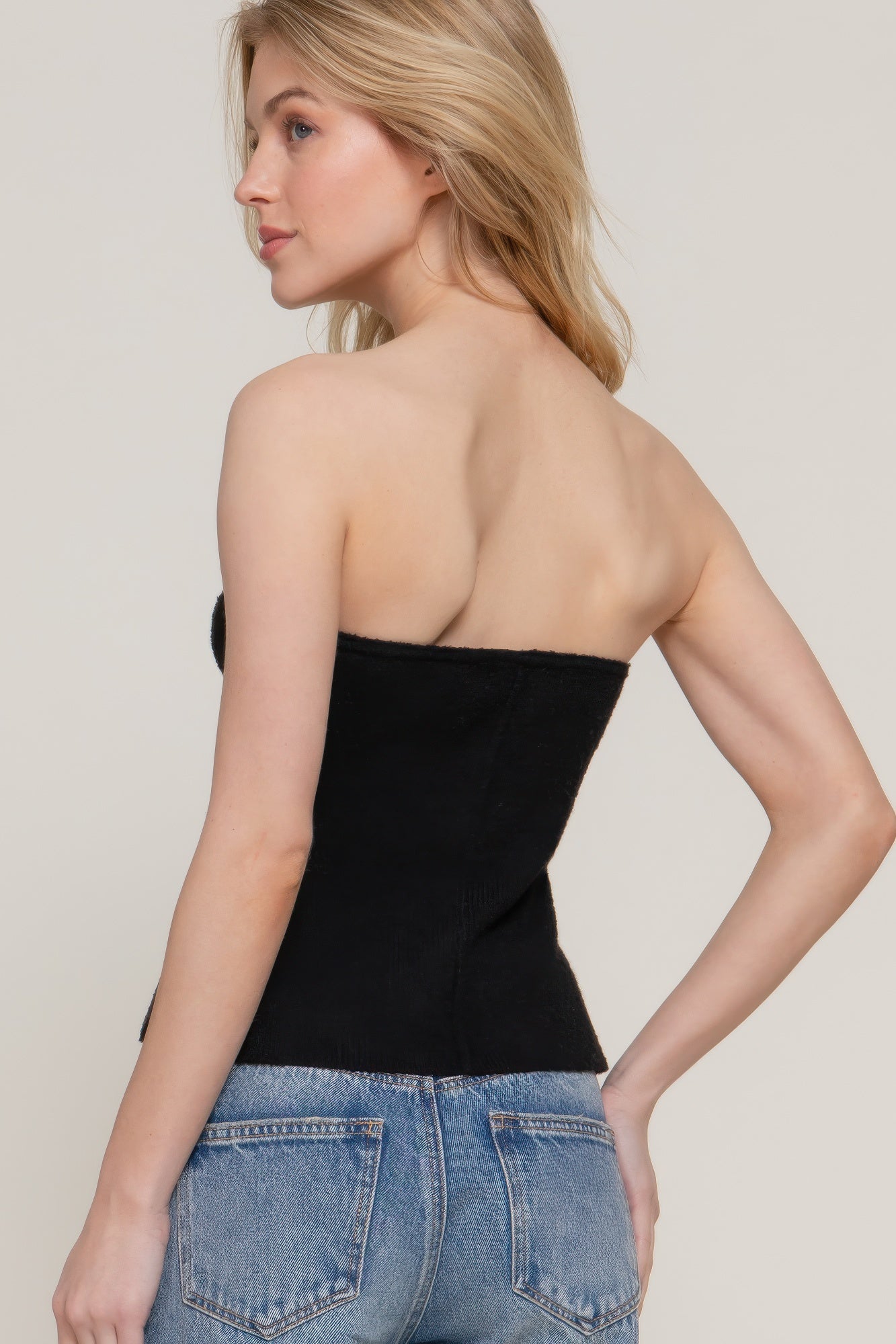 Black tube spring sweater back view, strapless fit with exposed back neckline