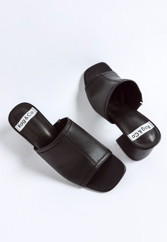 Black slide heels, padded insole and thick block heel detail from above