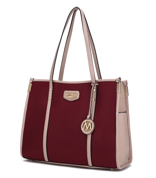 Oversize tote in blush/pink with wine-red panels, long handles, and M charm