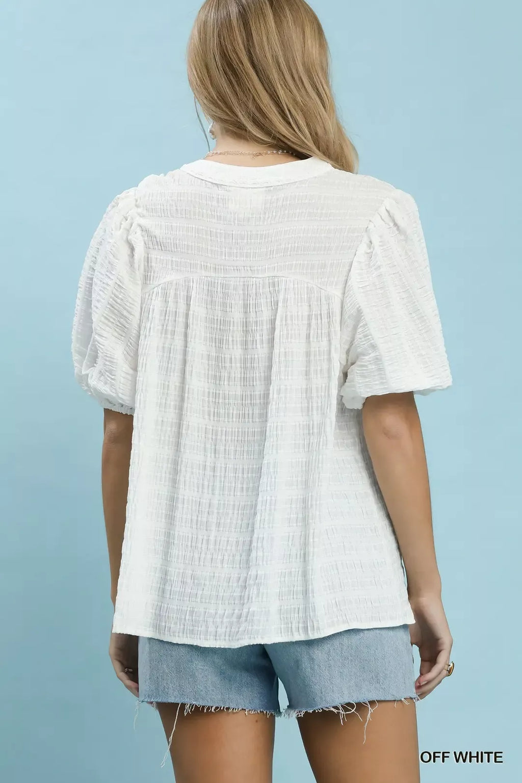 Off-White textured blouse, back view, short puff sleeves