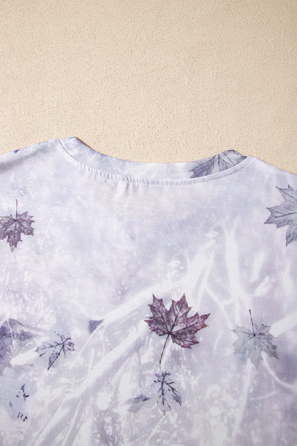Light gray tunic tee neckline and upper back with woodland camouflage leaf print detail
