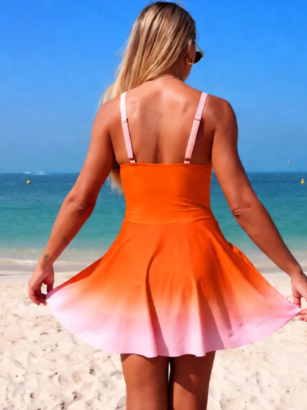 V-neck gradient one-piece swimsuit, open back straps, orange to pink skirt