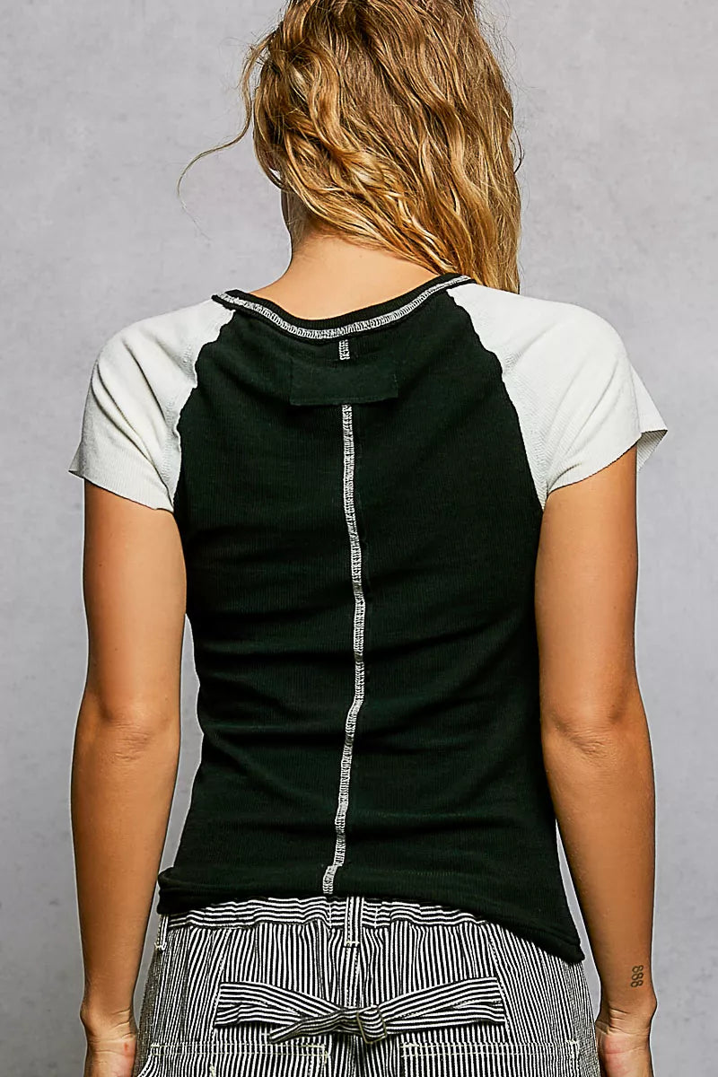 Back view: POL round-neck T-shirt with black center panel, ivory sleeves, and outseam stripe
