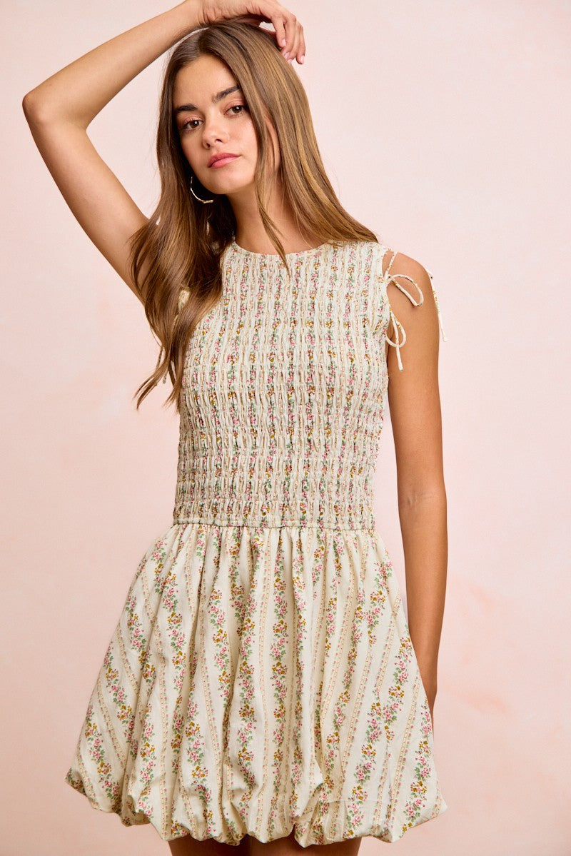 Ivory floral smocked dress with tie puff sleeves and full gathered skirt hem