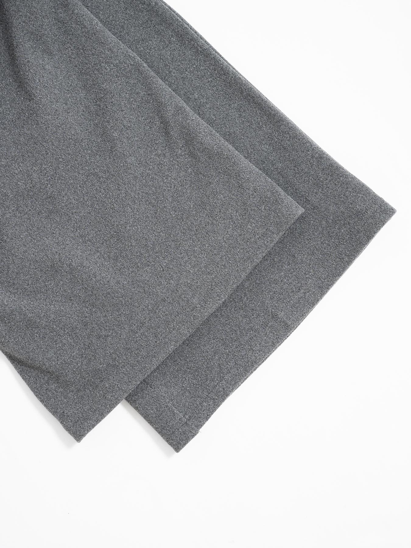 Gray drawstring pants hem and drape, wide-leg fabric fold detail