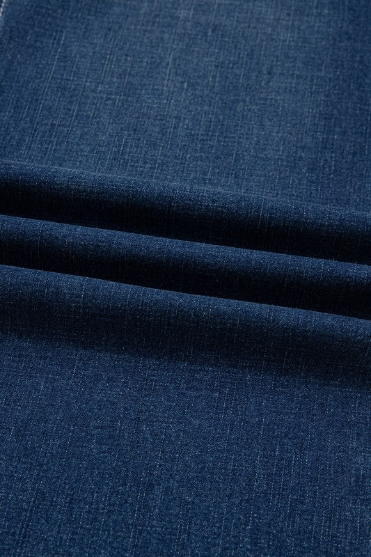Close-up of Sail Blue denim fabric texture and topstitching lines