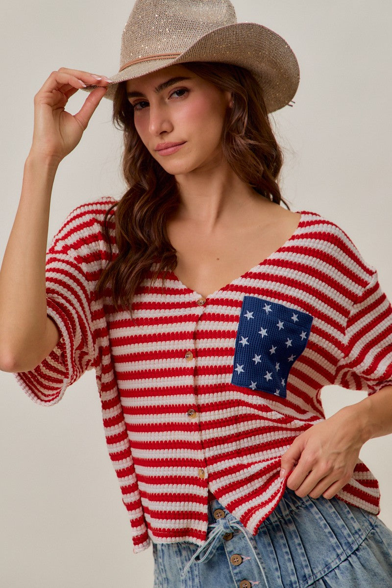 Red-and-ivory striped cardigan top with V-neck buttons and blue star patch pocket