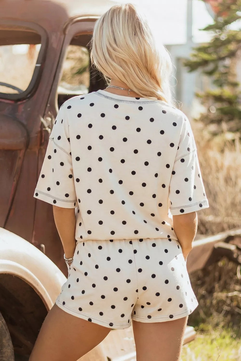Cream polka dot tee and shorts set, back view; elastic waistband with drawstring