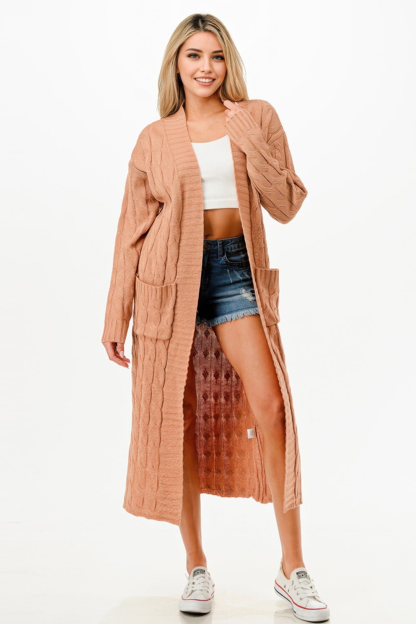 Long cable cardigan in camel, open front with side pockets detail.
