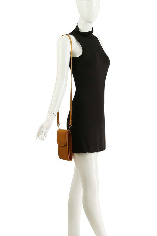 Flap cell phone crossbody bag worn crossbody with adjustable strap; tan exterior