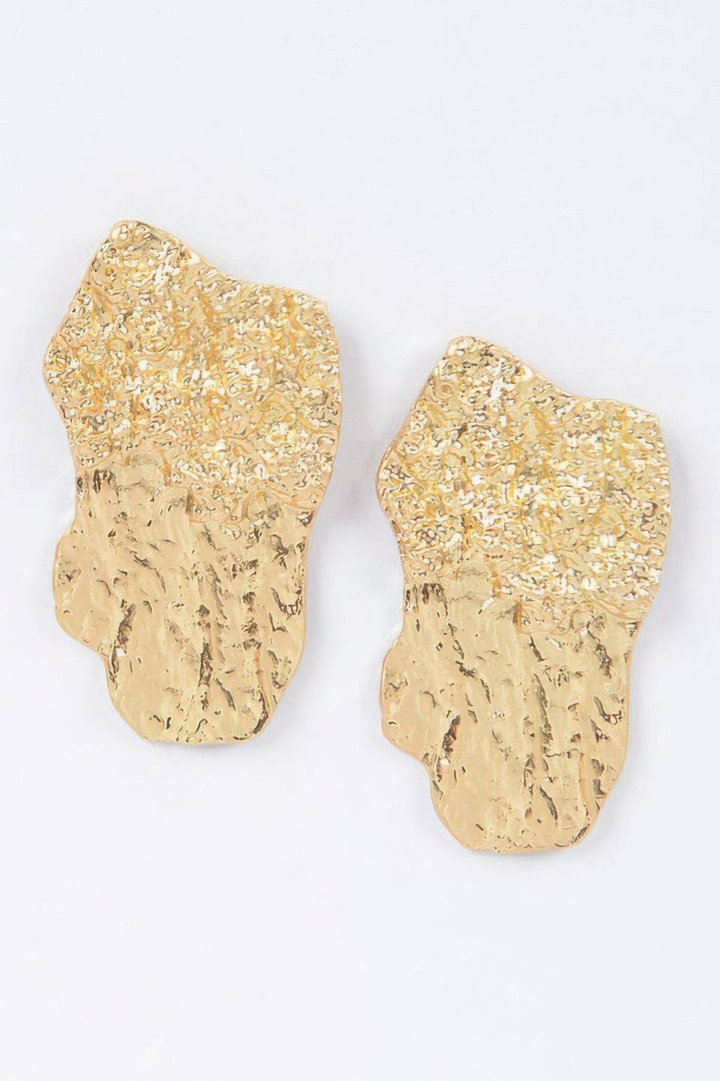 Gold cast metal earrings, textured abstract teardrop shapes