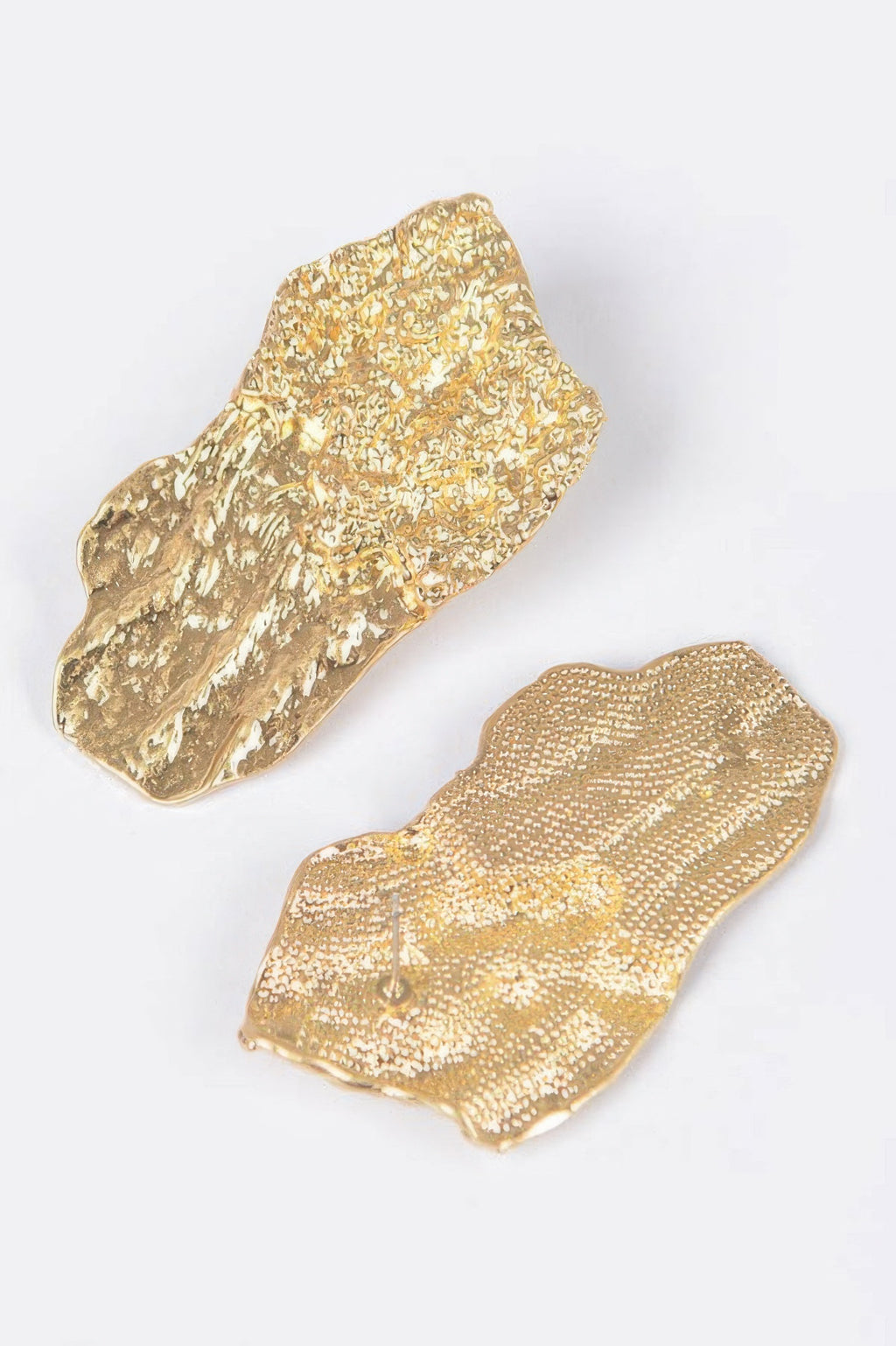 Gold cast metal earrings, glittery textured curved plates with scalloped edges