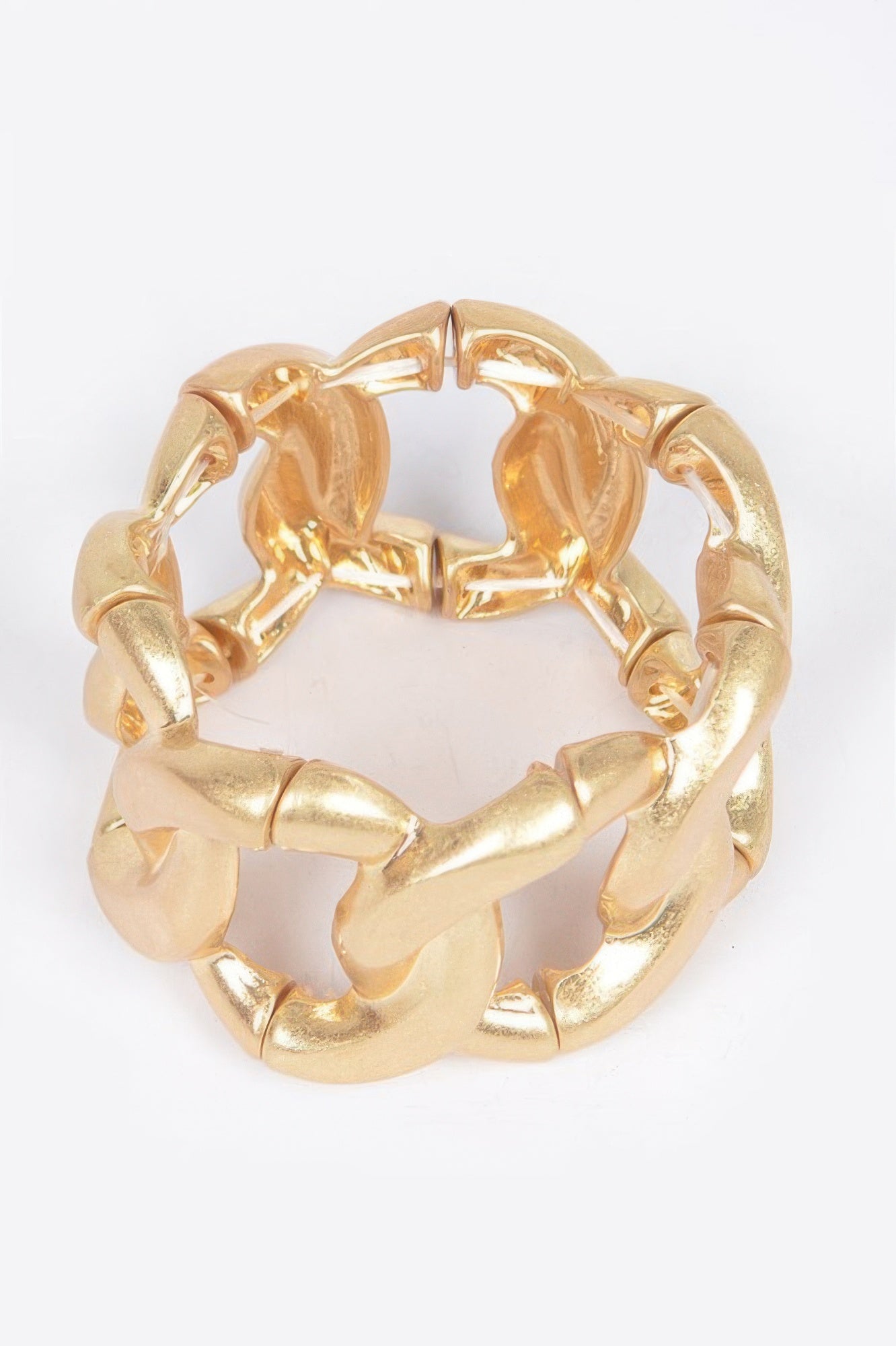 Gold hinged cuff with circular open links and spring hinge mechanism, polished