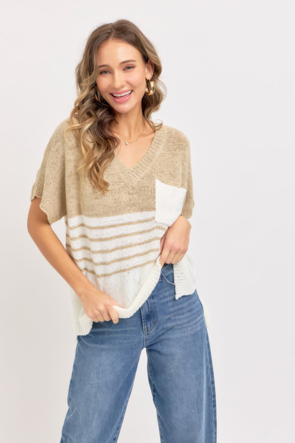 Taupe knit top, V-neck and short sleeves; white pocket with horizontal stripe detail