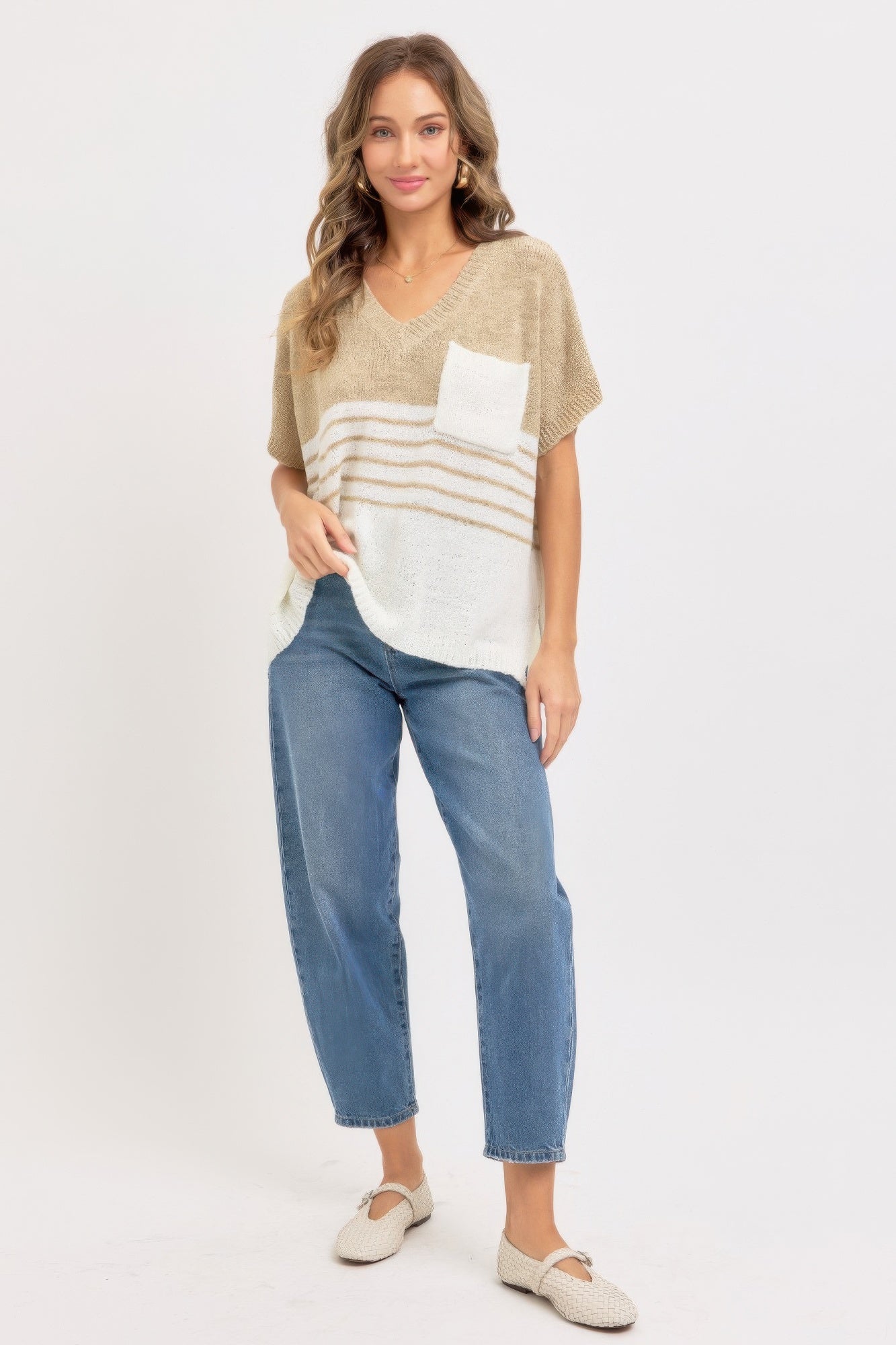Taupe oversized knit top with white chest pocket; horizontal stripe pattern and V-neck