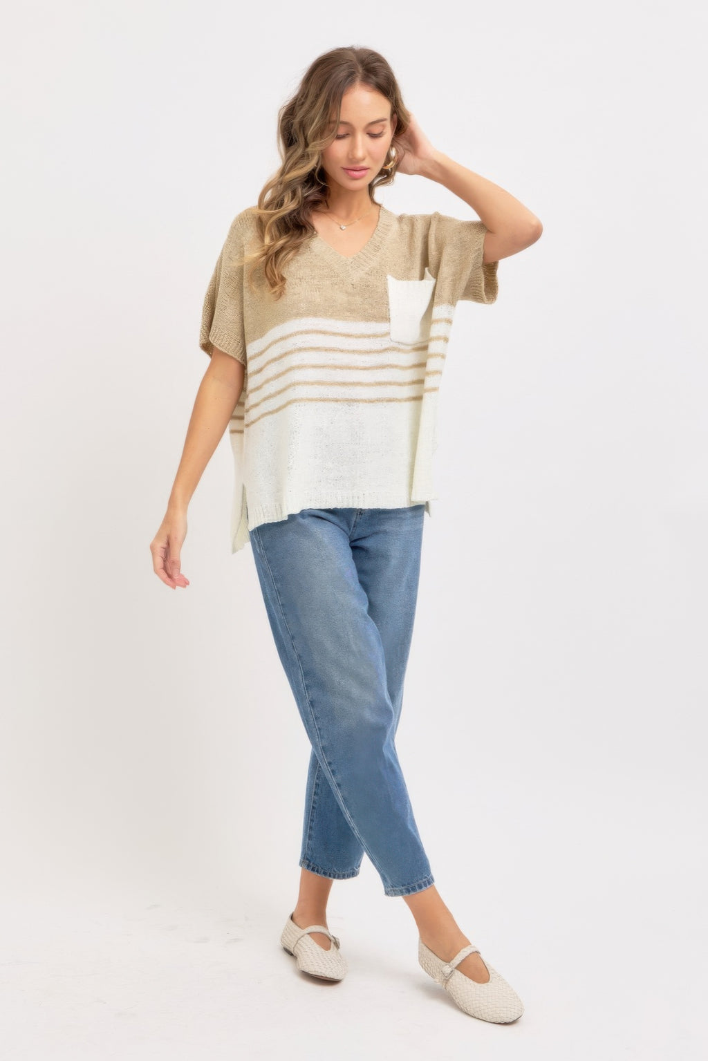 Taupe knit top with V-neck, short sleeves, white pocket and horizontal stripes at hem