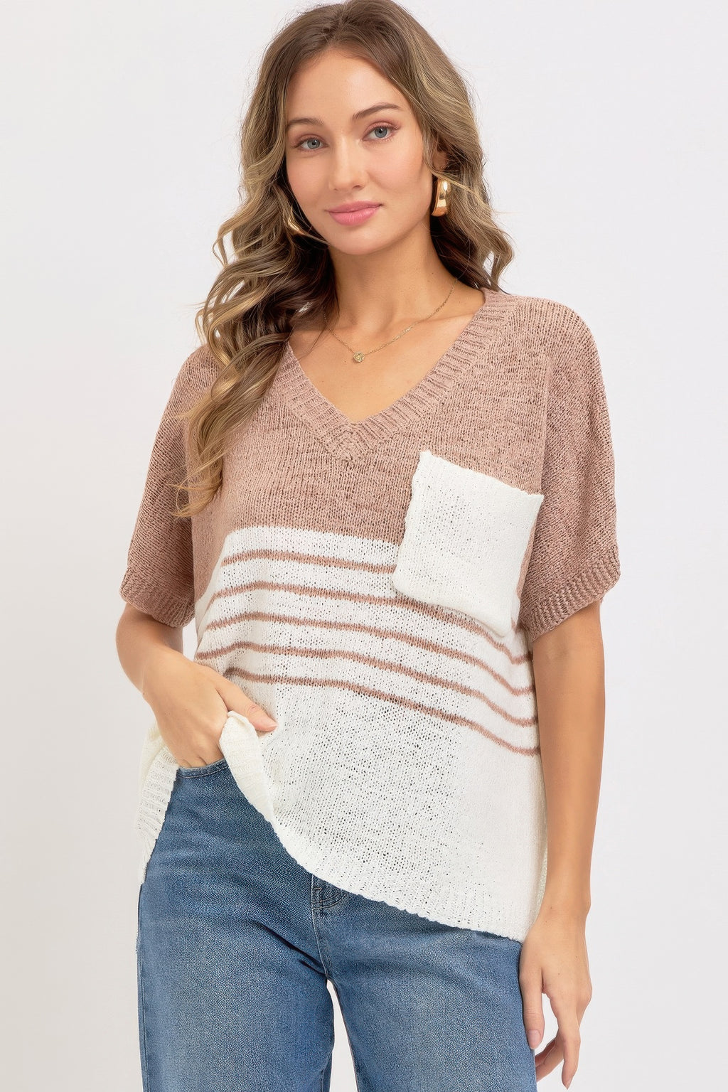 Mauve oversized knit top with V-neck, short sleeves; white pocket and horizontal stripes