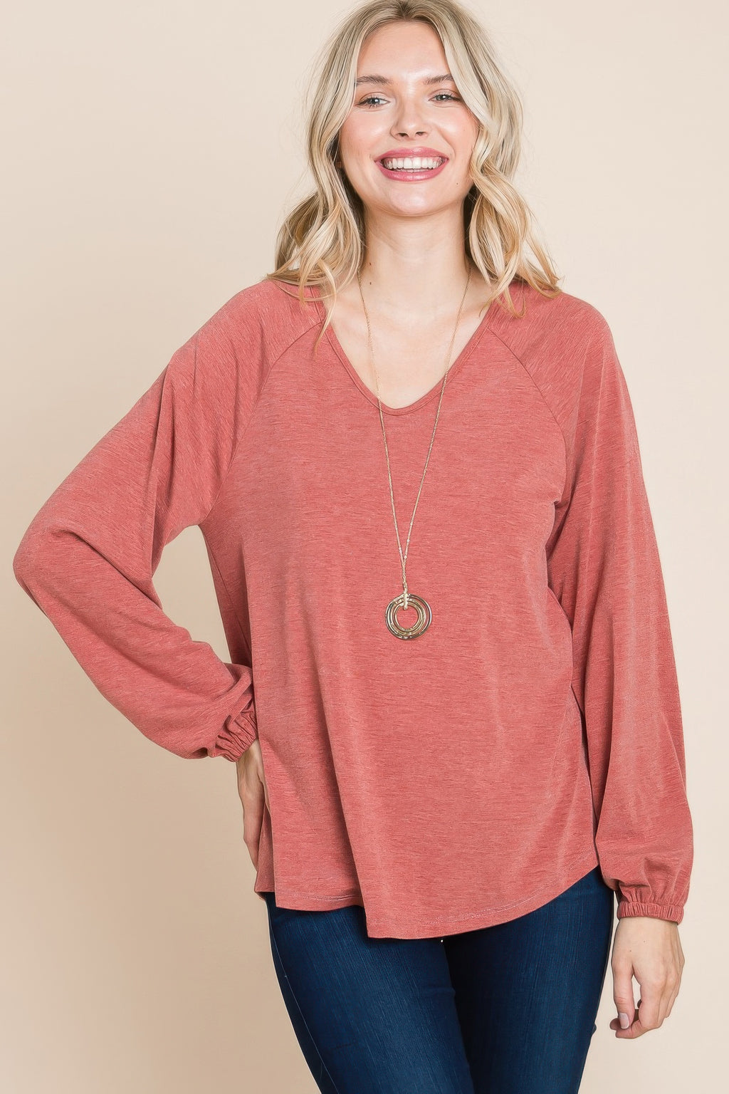 Rust long-sleeve V-neck basic top with straight neckline and relaxed body