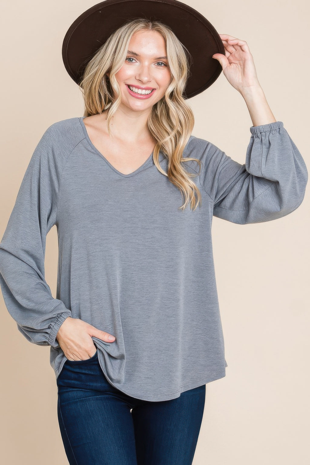 Grey V-neck long-sleeve top, relaxed silhouette with gathered sleeve ends