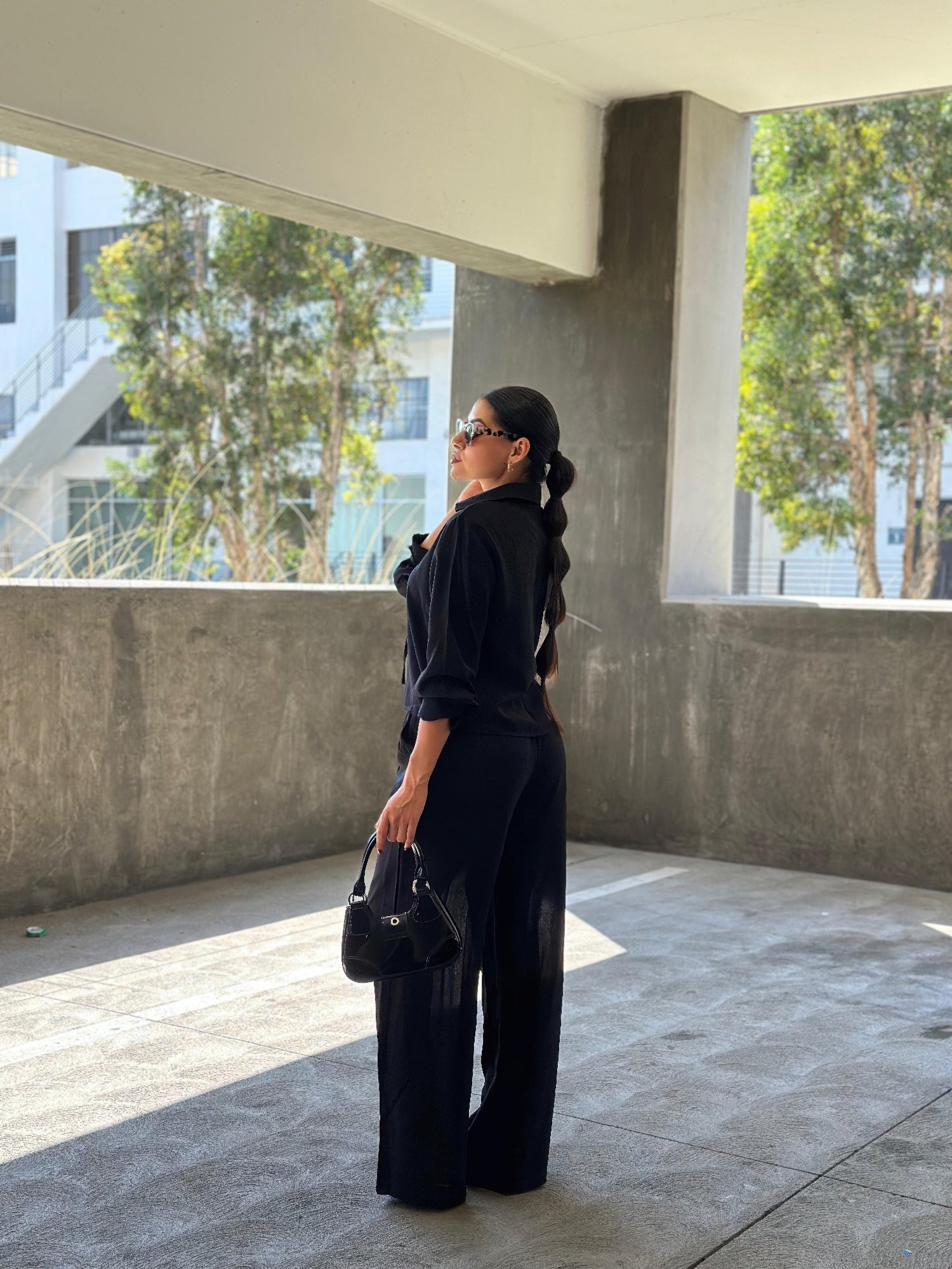 Back view long-sleeve top and wide-leg pants, front tie detail
