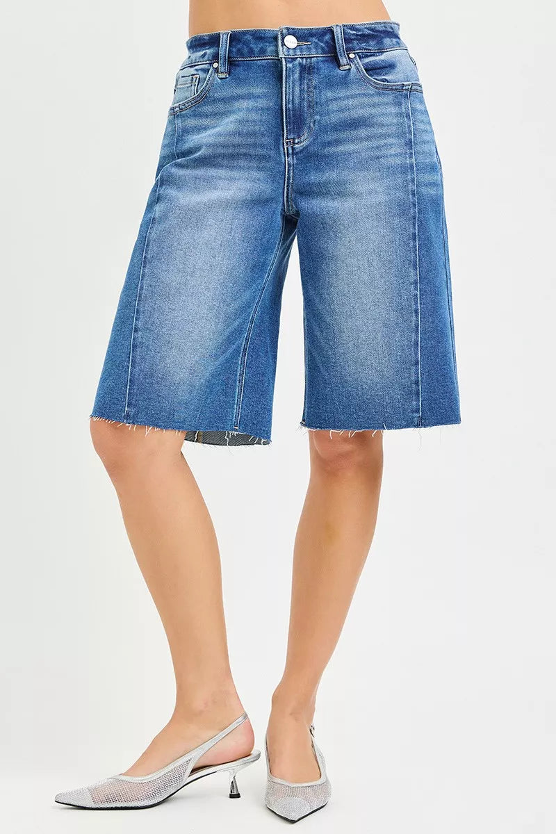 Slouchy seamed jorts, medium wash denim, front pockets, raw frayed hem