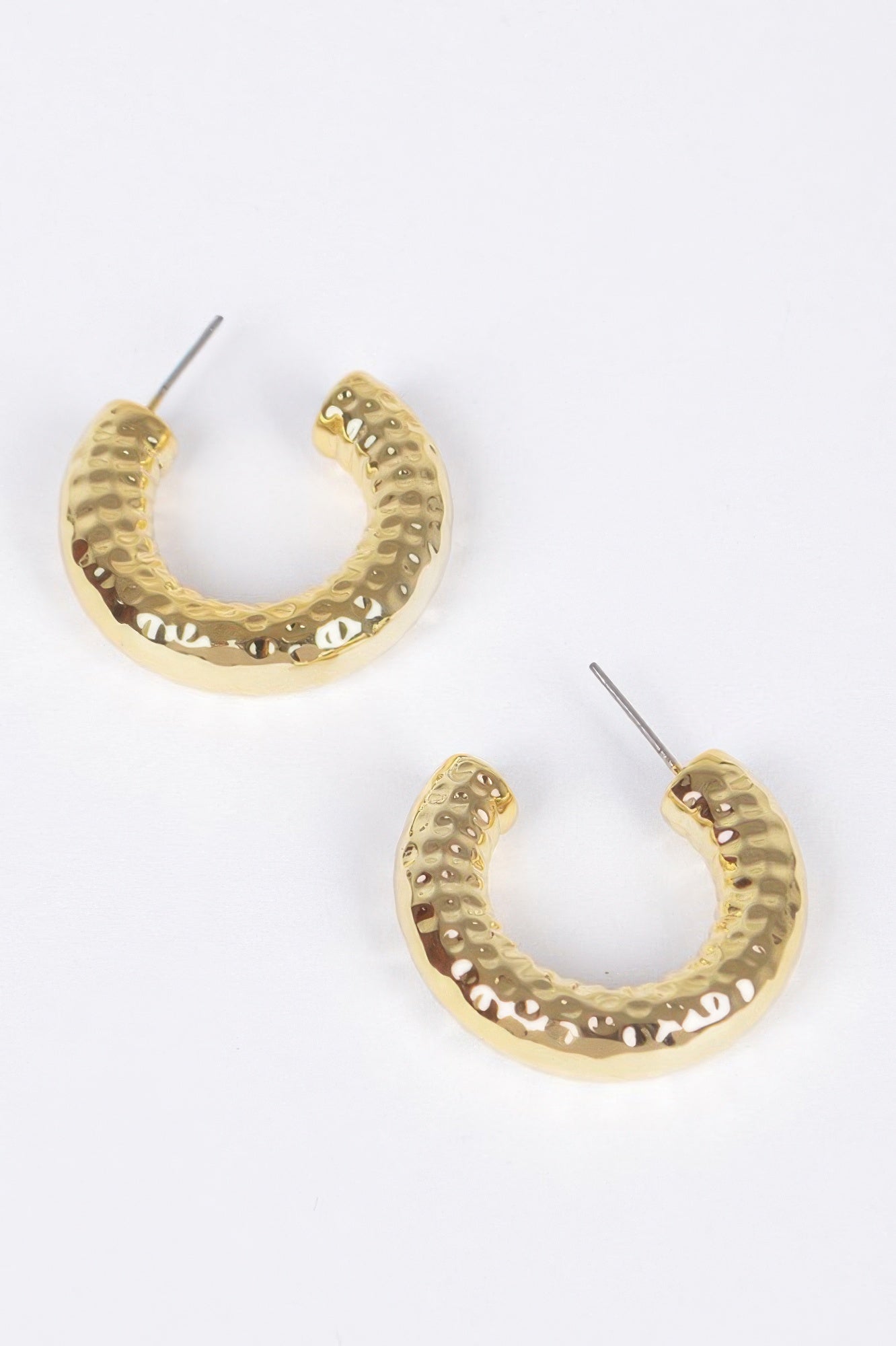 Gold CCb hoop earrings with hammered texture and visible stud posts