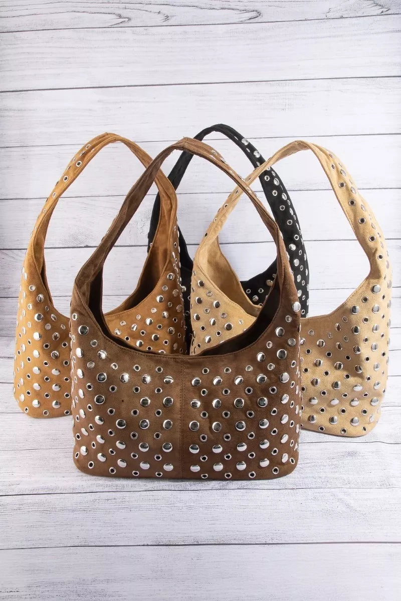 Studded shoulder bag shown in tan, dark brown, and black with silver rivets