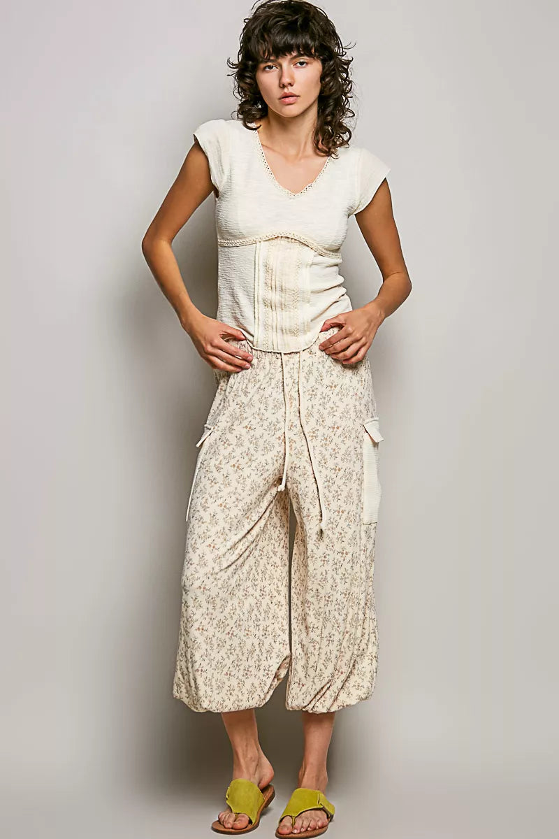 Cream lightweight knit top, V-neck with lace trim and fitted textured panel