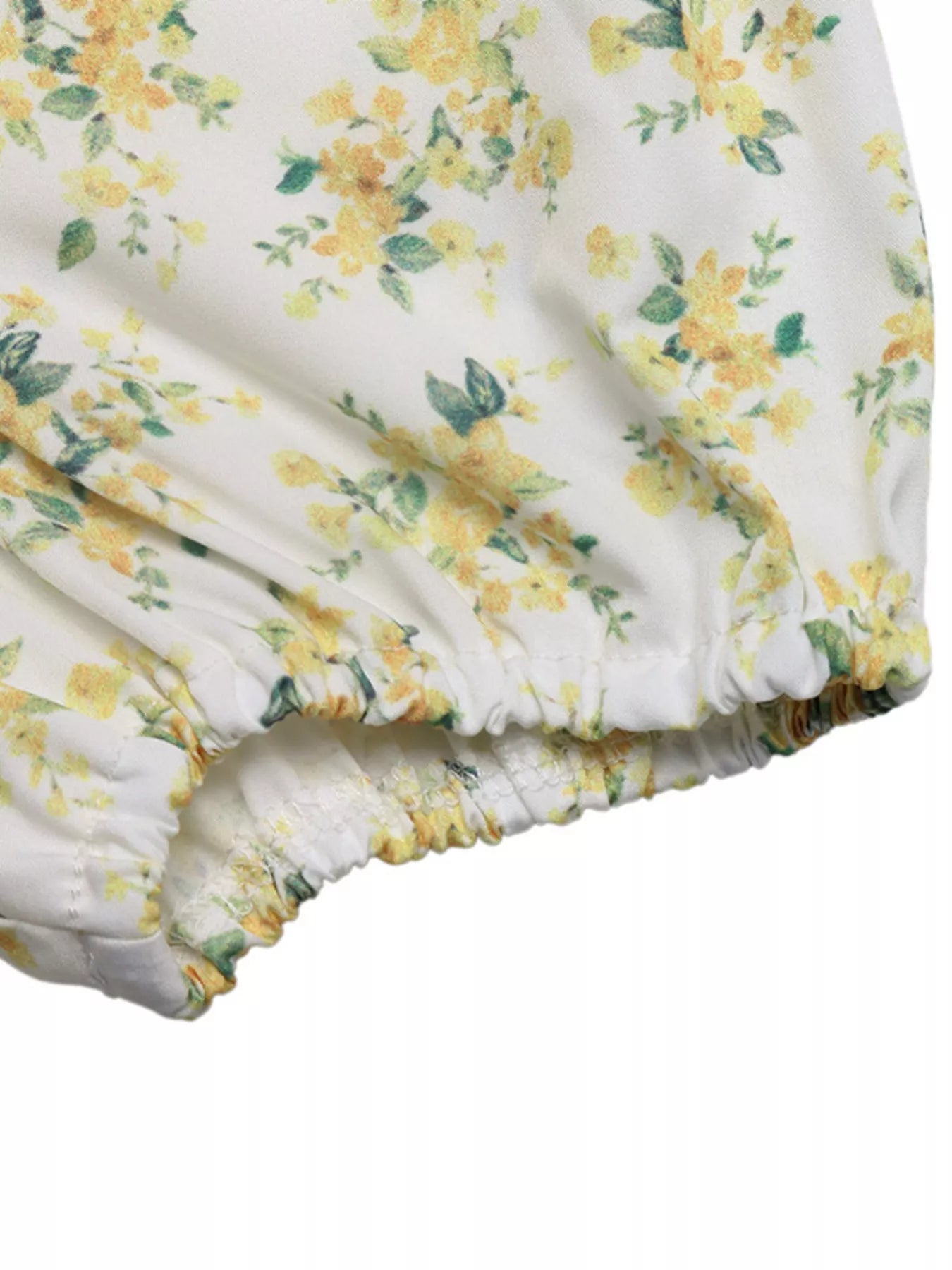 Puff sleeve cuff and elastic waist on yellow floral mini dress