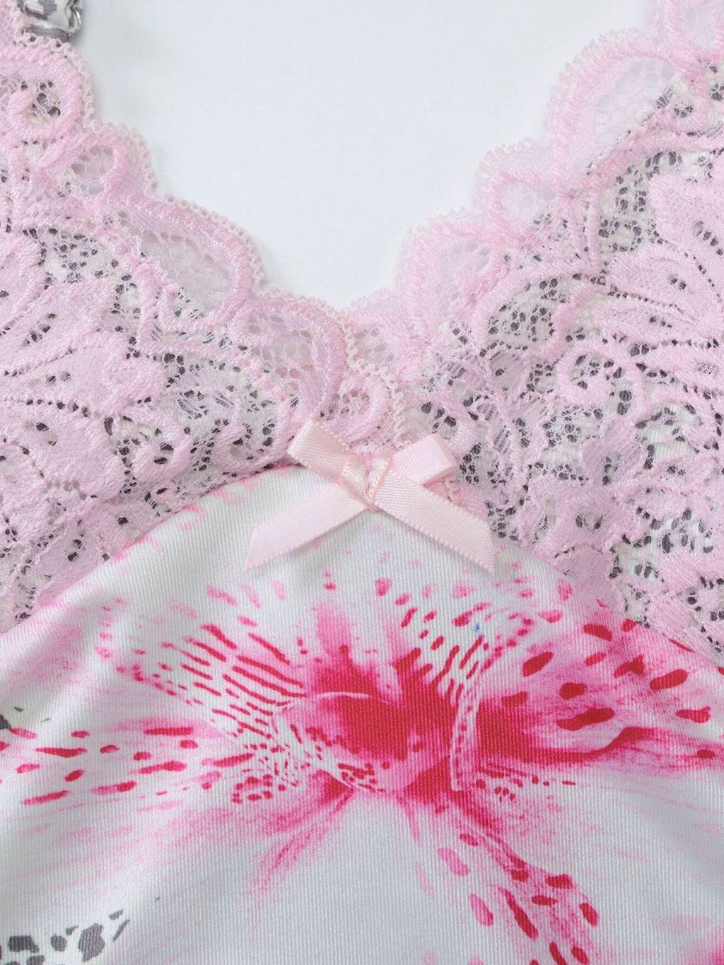 Close-up of dusty pink lace bra-cami with bow detail and leopard-print panel