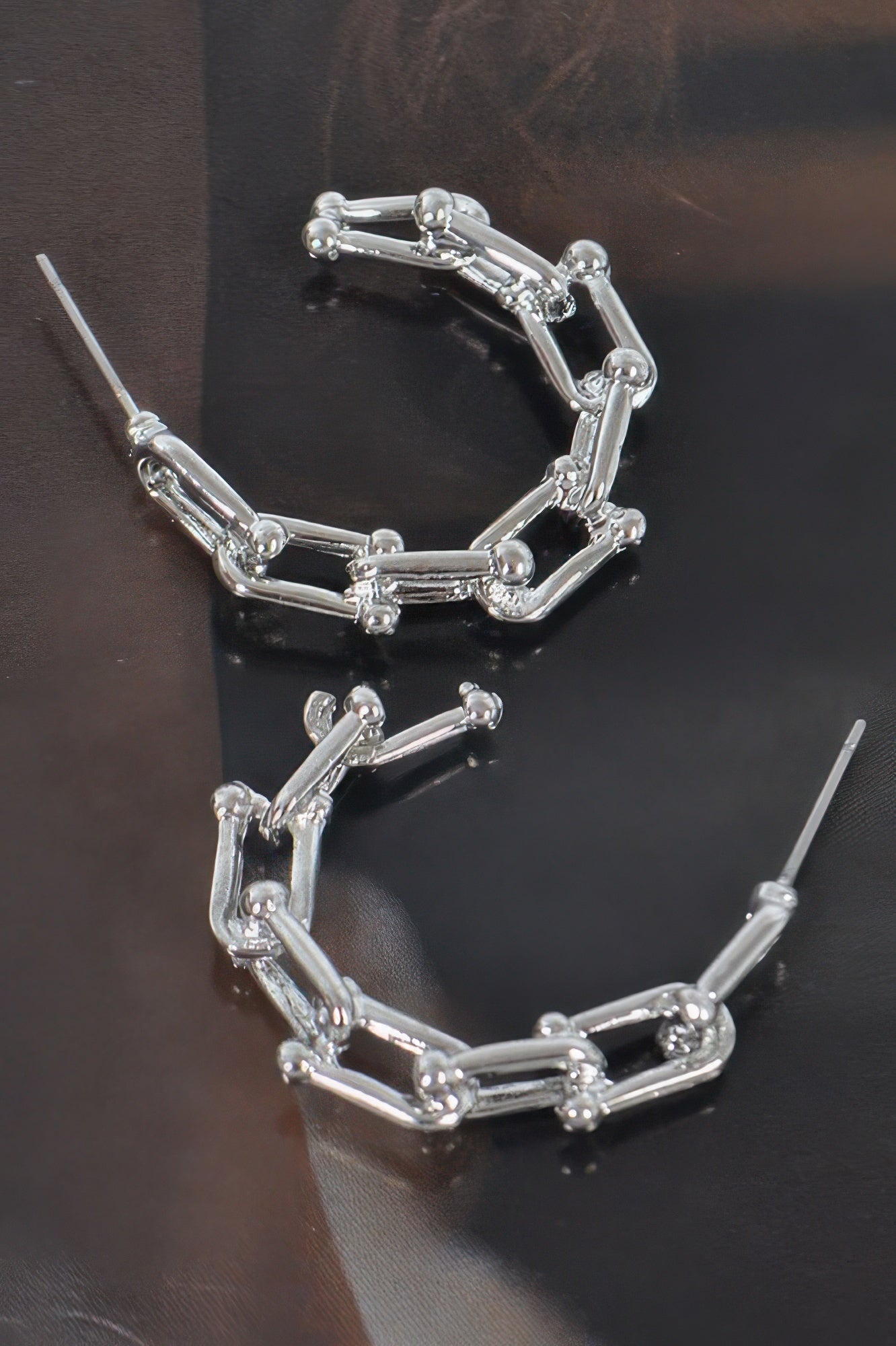 Silver-tone chain hoop earrings with rectangular link pattern and hinged hoop