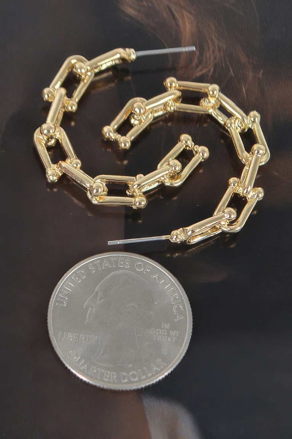 Gold-tone chain hoop earrings with chunky rectangular links and stud closure