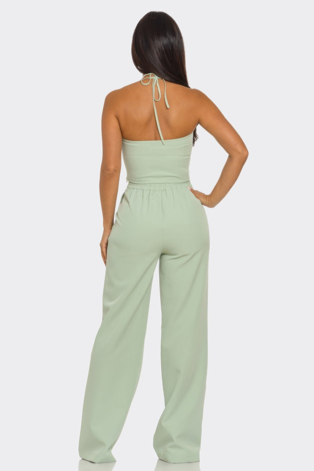 Back view: sage halter crop top tie-back and matching wide-leg pants