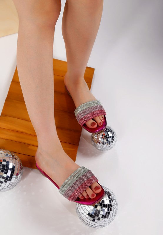 Fuchsia slip-on flats with rhinestone strap over toes in silver and rose tones