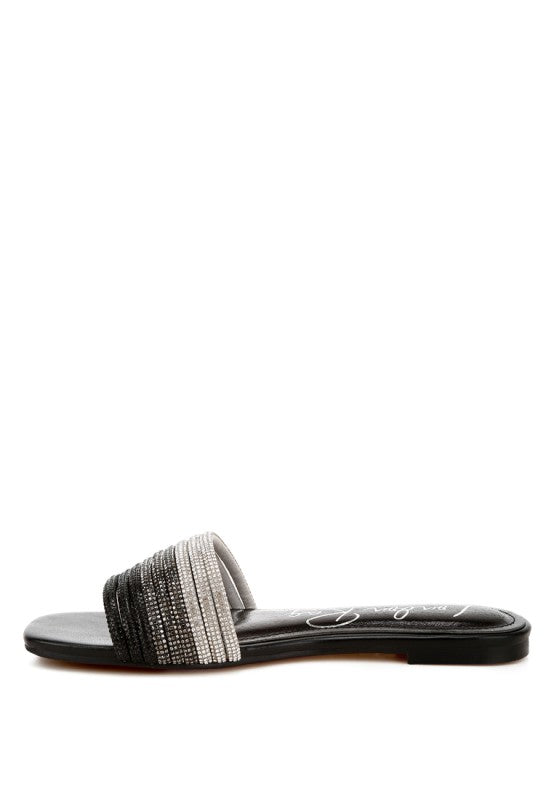 Black slide flats with ombré rhinestone strap across the upper