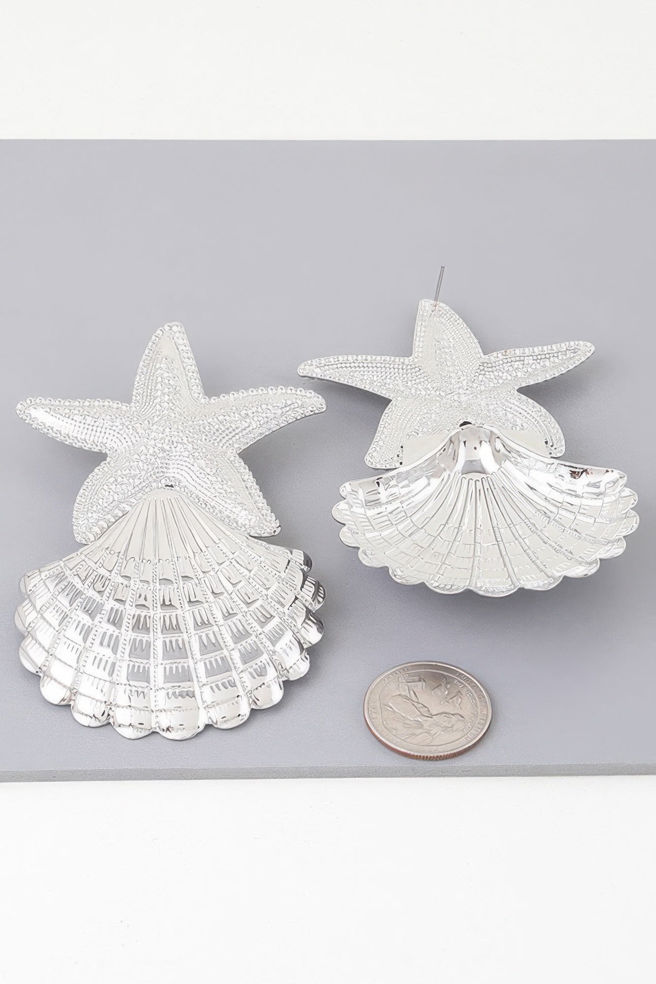 Silver starfish and clam earrings, textured shell and starburst shapes