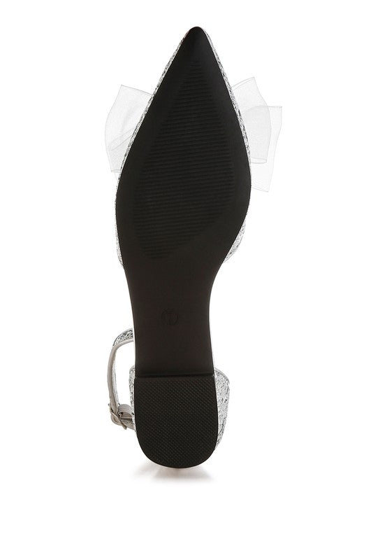 Black flat sandals with glitter accent, sheer bow detail, and ankle strap