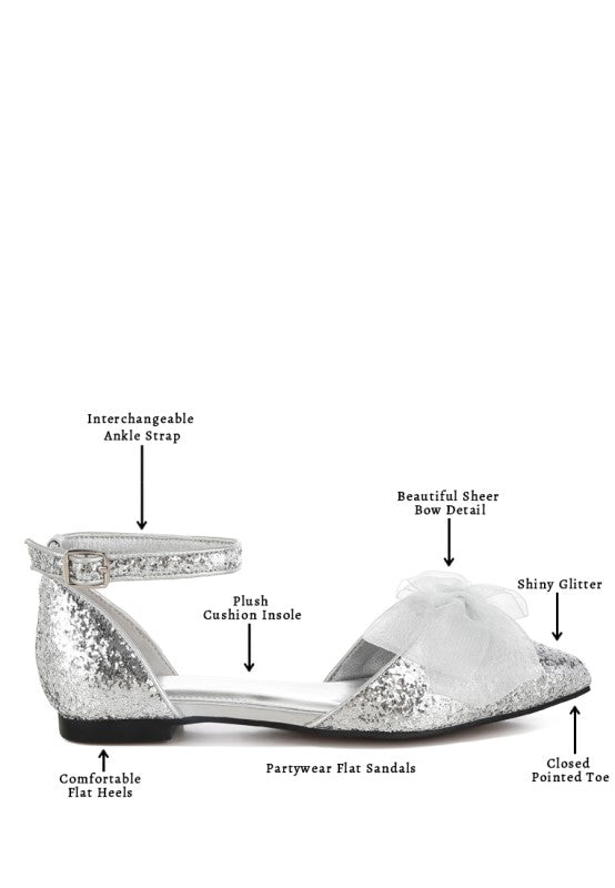 Silver flat sandals with interchangeable ankle strap, sheer bow detail, and glitter finish