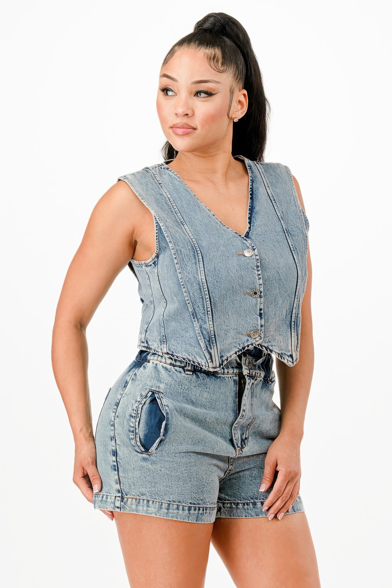 Denim vest with V-neck and metal buttons, paired with fitted denim shorts