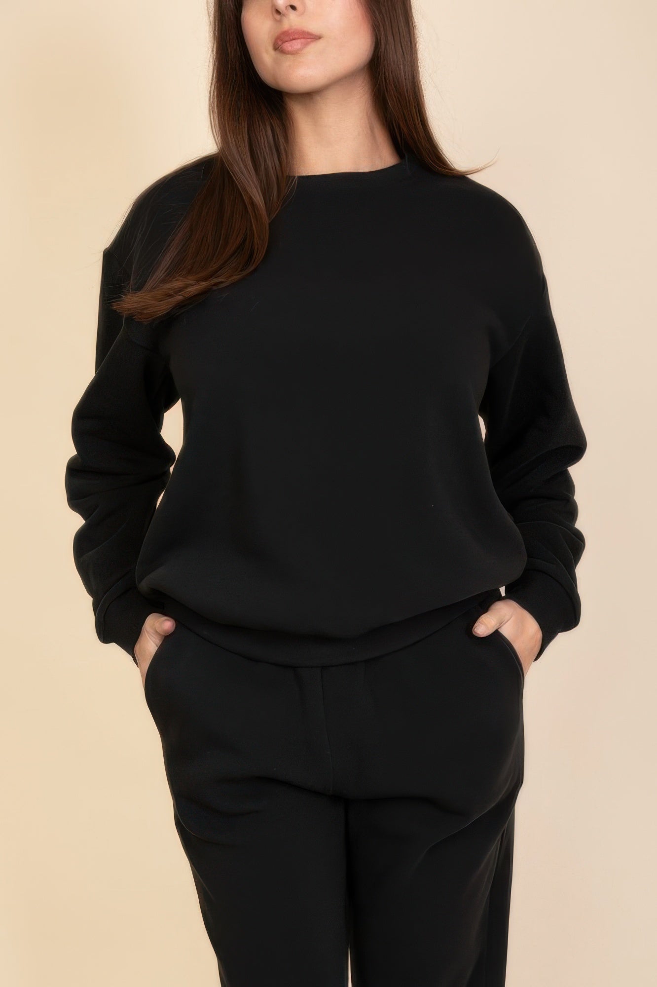 Black crewneck pullover front view with long sleeves and ribbed neckline