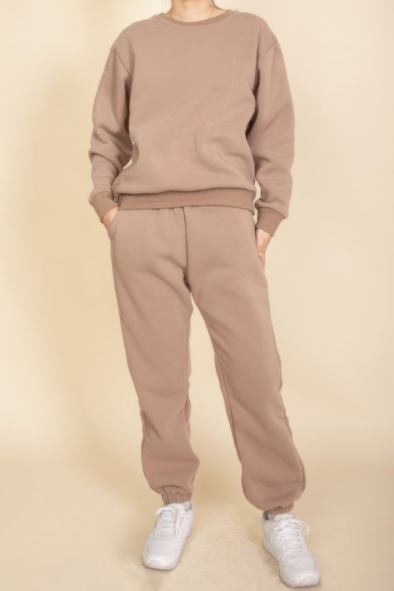 Taupe poly fleece crewneck pullover with ribbed crew neck, cuffs, and hem