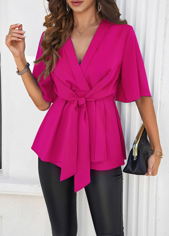 Magenta tie-front V-neck blouse with short sleeves and sash at waist