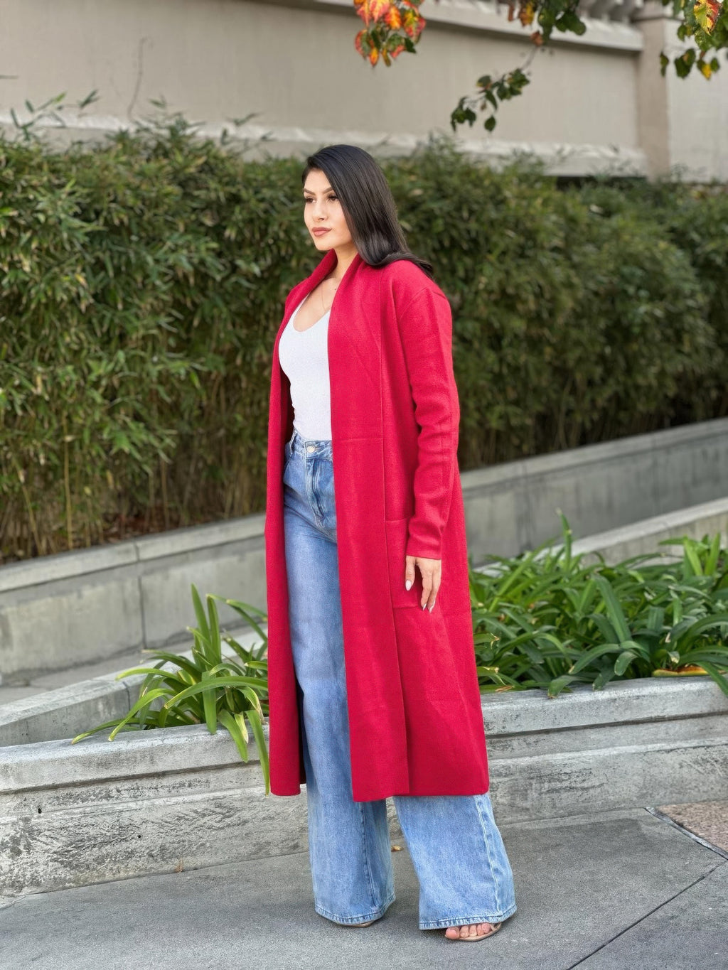 Red open-front midi knit cardigan with pockets, full-length view