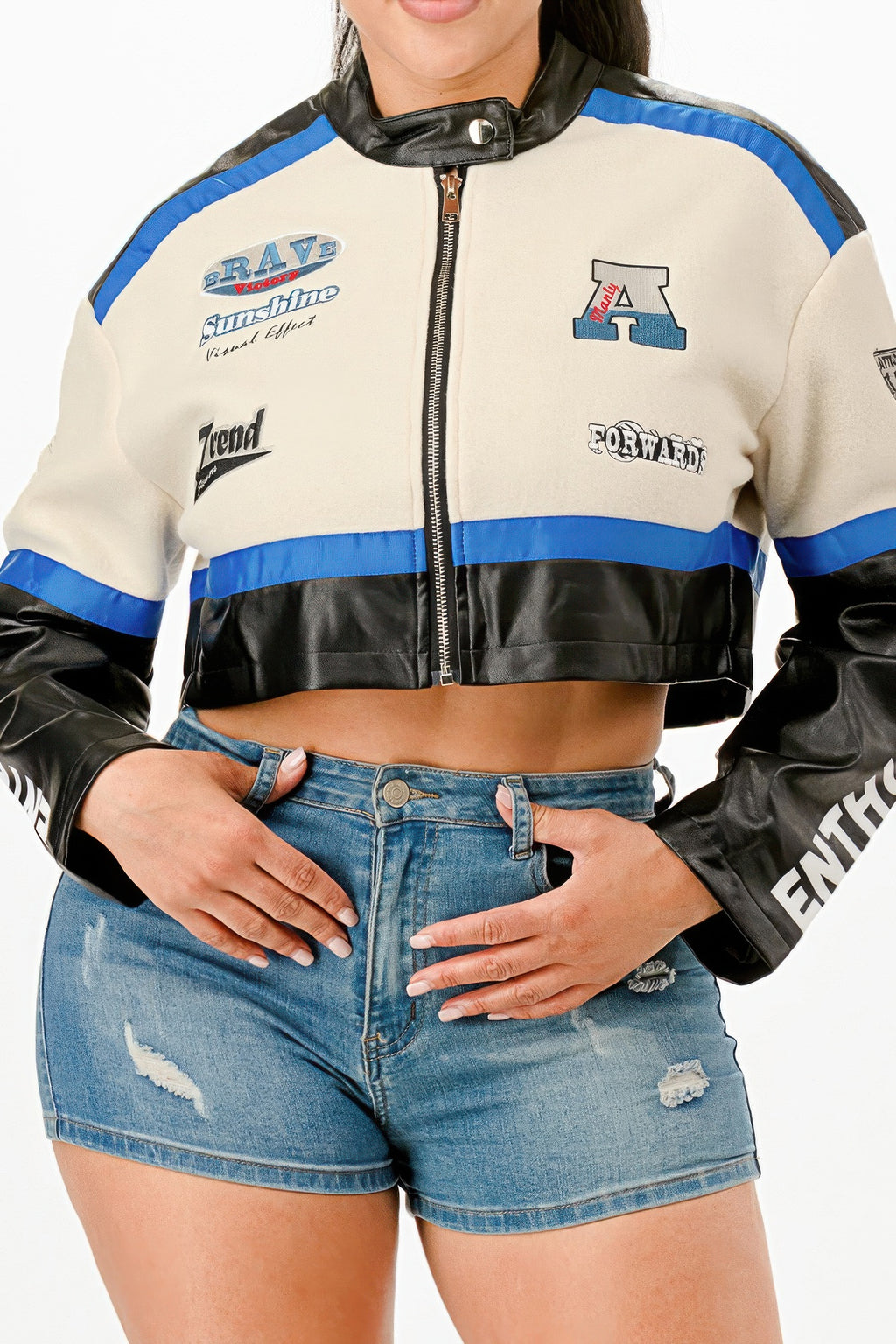 Colorblock crop jacket close-up, front zipper, cream and black panels with blue stripe