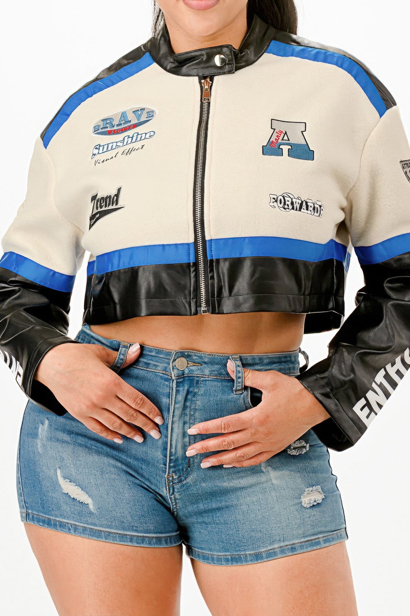 Colorblock crop jacket close-up, front zipper, cream and black panels with blue stripe